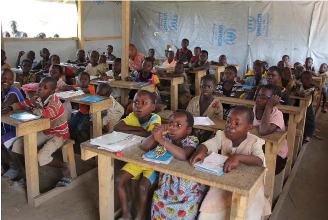 Refugee children in a Civic Education classroom at Nakivale Refugee Settlement